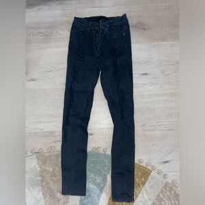 Black super skinny ripped jeans